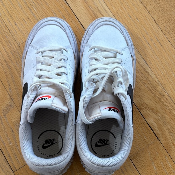 Nike White Low-Top Sneakers with Black Swoosh and Gold Accent - Picture 4 of 15